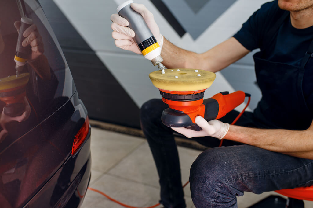 man preparing car for ceramic coating