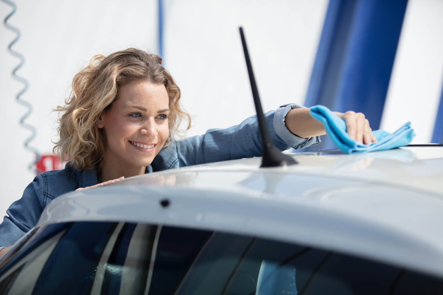 woman using best microfiber towel for car care