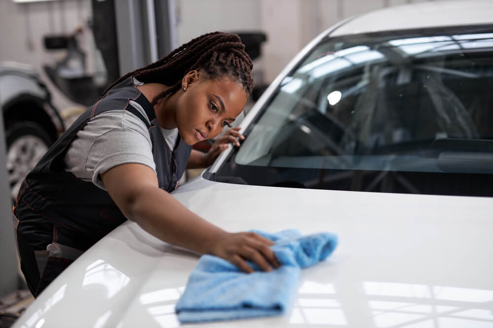 woman fixing different types of scratches on cars